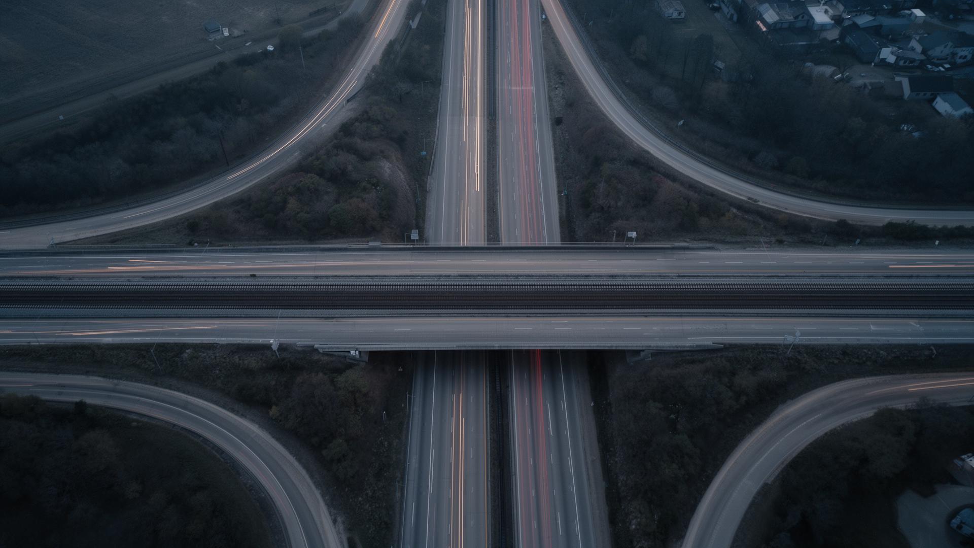 Highway and rail corridor at dusk